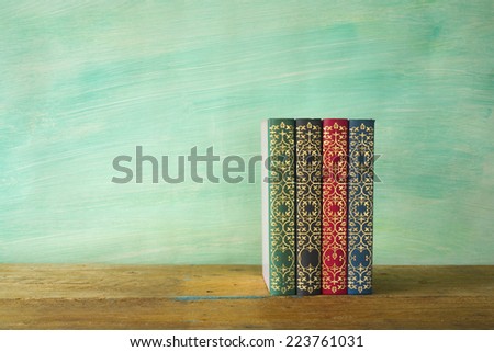 row of books, grungy background free copy space 