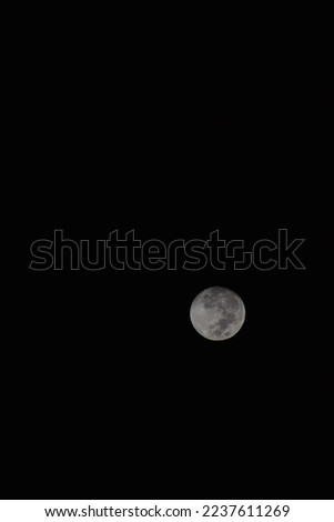 selective focus picture of full moon in the sky
