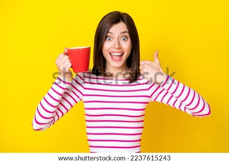 Photo of satisfied funky joyful lady girl raise hand arm finger enjoy quality cafe service isolated on yellow color background