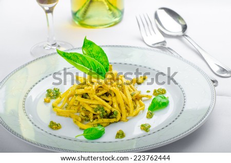 Italian pasta with basil pesto, late harvest wine on white