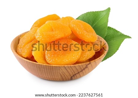 Dried apricots in wooden bowl isolated on white background and full depth of field. Royalty-Free Stock Photo #2237627561