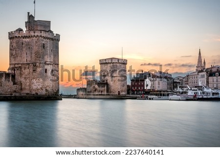 La rochelle harbor at sunset. Panorama skyline. the famous towers of La Rochelle are illuminated with christmas light.
