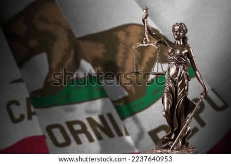 California US state flag with statue of lady justice and judicial scales in dark room. Concept of judgement and punishment, background for jury topics