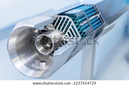 Fragment energy fuel uranium or thorium rod element of nuclear reactor water. Royalty-Free Stock Photo #2237654729
