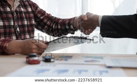 Shaking hands, Loan approver, businessman in suit, man giving car keys after car loan approval and contract signing