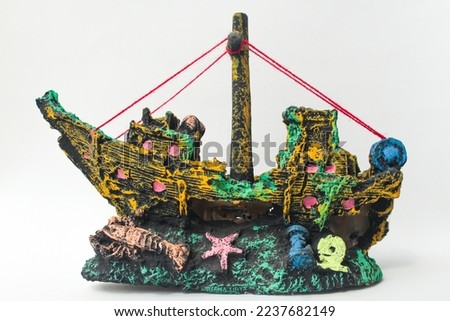 Decorations for aquarium isolated on a white background, Aquarium accessories in the shape of a sunken pirate ship.
