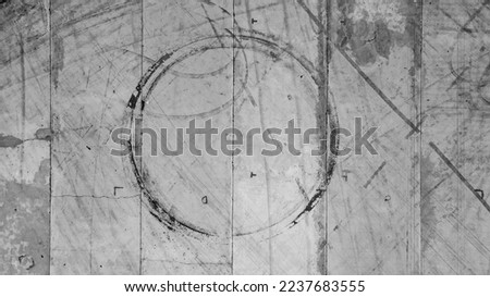 Tire tracks texture and background, Asphalt texture with line and tire marks, Automobile automotive tire skid mark on race track, Abstract texture car drift tire skid mark. Royalty-Free Stock Photo #2237683555