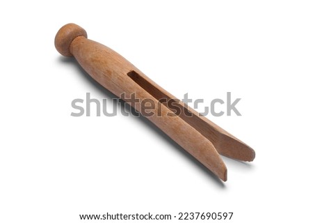Old Wooden Clothes Pin Cut Out on White. Royalty-Free Stock Photo #2237690597