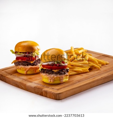 Small burgers served on wood plate , White Background