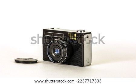 Retro camera for taking pictures on film on a light background