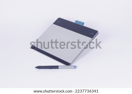 Graphics tablet isolated on white background.
Concept Business and Music