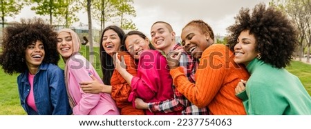 diverse multiracial women having fun outdoors laughing together, a group of women with different body sizes and different cultures Royalty-Free Stock Photo #2237754063