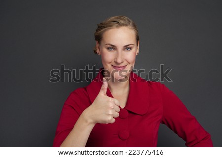 Smiling business woman thumb up show. isolated dark background