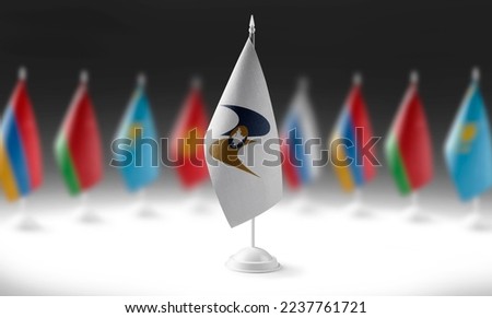 The national flag of the Eurasian Economic Union on the background of flags of other countries Royalty-Free Stock Photo #2237761721
