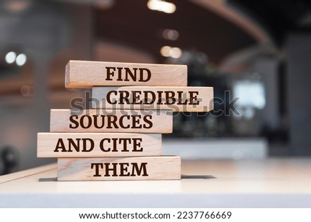 Wooden blocks with words 'Find credible sources and cite them'. Royalty-Free Stock Photo #2237766669