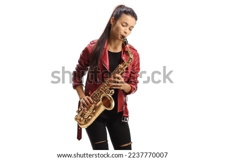 Beautiful young woman playing a saxophone isolated on white background Royalty-Free Stock Photo #2237770007