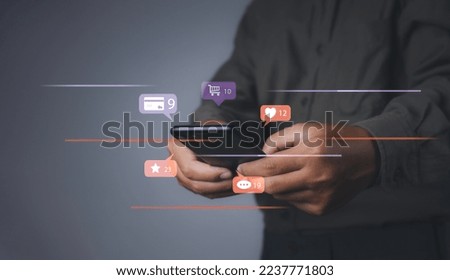 Man using mobile phone shopping online marketing with social media notification icons of love, message, comment, chat, email. and shopping cart. Digital online marketing commerce sale .