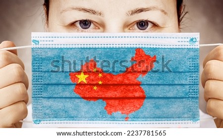 Face mask with flag of China. Zero covid in China. Covid 19 outbreak in China Royalty-Free Stock Photo #2237781565