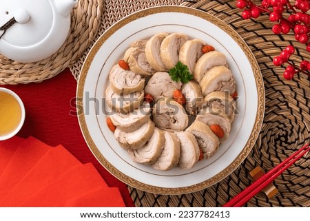 Top view of delicious sliced chicken roll soaked in Chinese wine named drunken shrimp for lunar new year's dishes. Royalty-Free Stock Photo #2237782413