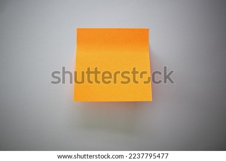 note paper - paste over the orange color Royalty-Free Stock Photo #2237795477