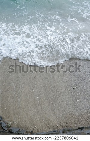 foam of sea waves on the beach