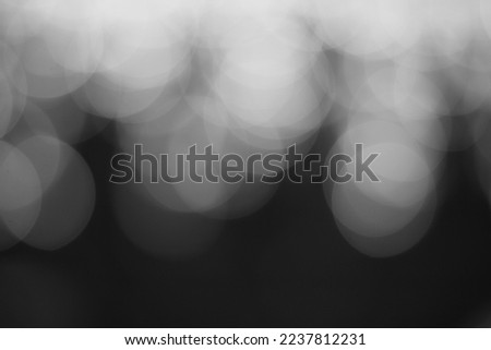 Festive bokeh and shining bright lights in a black and white monochrome.