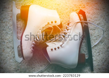 Pair of white ice skates Royalty-Free Stock Photo #223783129