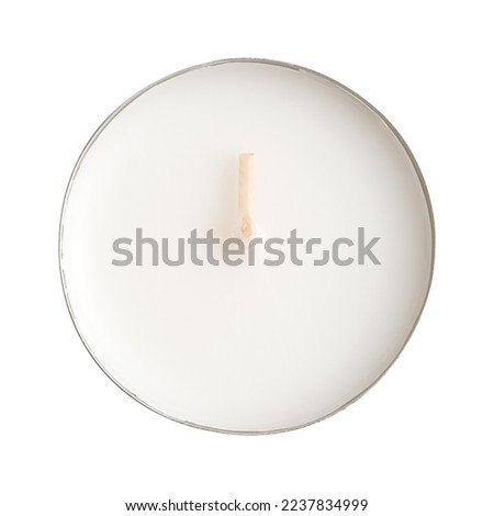 Maxi tealight, longer-burning tea light, a large tea candle, also known as nightlight, isolated from above. Tea lite, t-lite or t-candle in thin metal cup, so the wax can liquefy completely while lit. Royalty-Free Stock Photo #2237834999