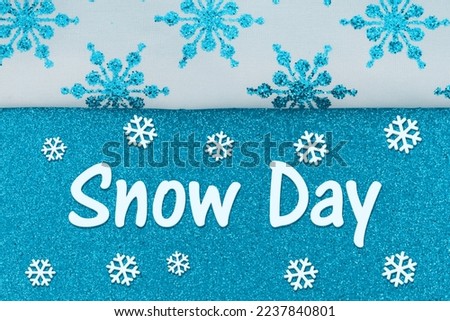Snow Day message with blue snowflakes on glitter material