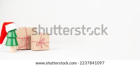 Christmas tree with boxes on a light background. New Year's Eve, Christmas and presents concept.