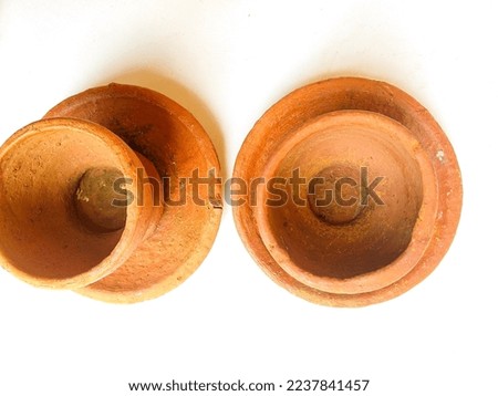 Indonesian Javanese traditional toys made from clay. Cookware set like pot, bowl, plate, cup and mortar. Isolated white background