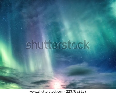 Beautiful Aurora borealis and starry glowing in the night sky on arctic circle background
