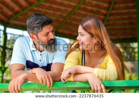 Young indian couple enjoying and spending quality time at park.