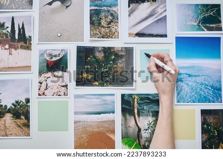 Photographer making notes on collage