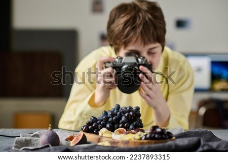 Woman taking pictures with professional camera