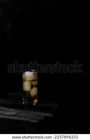Ice tea isolated on black background