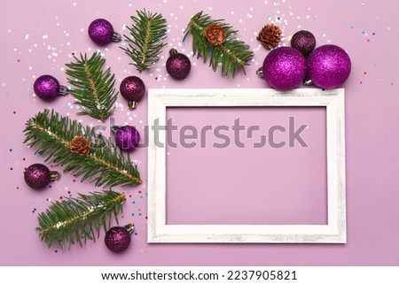 Composition with empty picture frame, Christmas balls and fir branches on color background