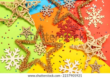 Composition with Christmas decorations and sequins on color background