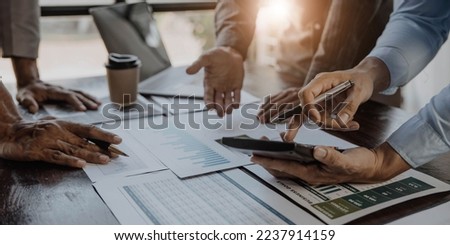 Business People Meeting using laptop computer,calculator,notebook,stock market chart paper for analysis Plans to improve quality next month. Conference Discussion Corporate Concept	
 Royalty-Free Stock Photo #2237914159