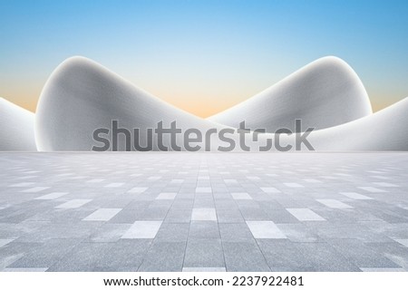 Modern art curved building with empty brick square against clear sky background. Royalty-Free Stock Photo #2237922481