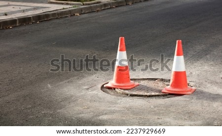 road hazard signaling cones. on road maintenance works