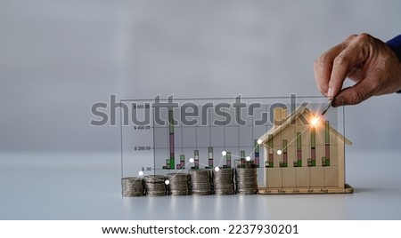 Property tax and market growth coins with stacks of coins on wooden table to show savings. Family plan. House. Loan. Money investment concept isolated on white background.
