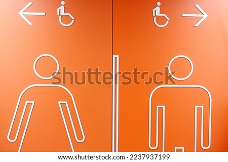Man woman bathroom toilet wall sign. France. 