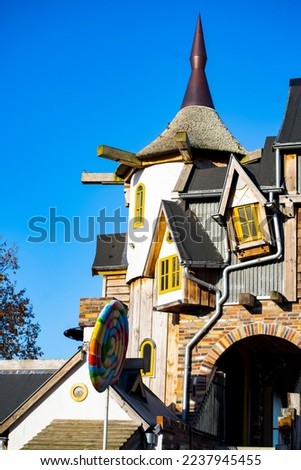 Fairy tale cottage house. Colorful view. Wooden houses. Full frame picture