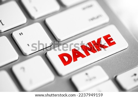 Danke (thank you in german) text button on keyboard, concept background Royalty-Free Stock Photo #2237949159