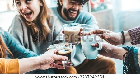 Happy friends having breakfast together at cafe bar - Group of young people drinking coffee and fresh juice sitting at brunch restaurant - Food and drink concept Royalty-Free Stock Photo #2237949351