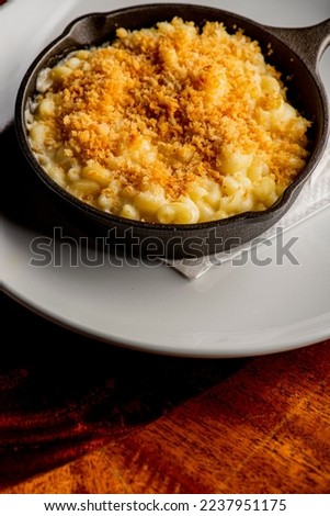 Macaroni and Cheese. Mac n cheese. Macaroni noodles and melted cheese. Parmesan, mozzarella, bacon, parsley. Classic American or Italian favorite. Homemade pasta with sauces, meats, cheeses. Favorite.