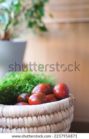 Handmade wicker basket with fresh farm vegetables. Healthy organic harvest. Tomatoes, dill.Gardening, farming as a hobby. Culinary. Ingredients for cooking vegetarian dishes. Local market. Artisanal.