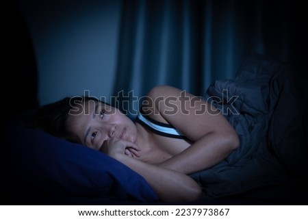 Asian women have a high concern that is why she can't sleep.Have stress from work Royalty-Free Stock Photo #2237973867