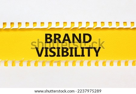 Brand visibility symbol. Concept words Brand visibility on yellow paper. Beautiful white background. Business branding and brand visibility concept. Copy space.
